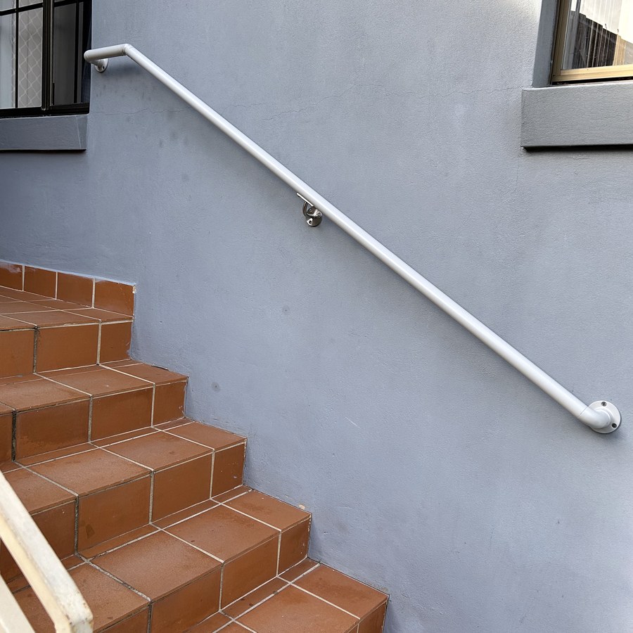White handrail on brick entry steps in Sydney